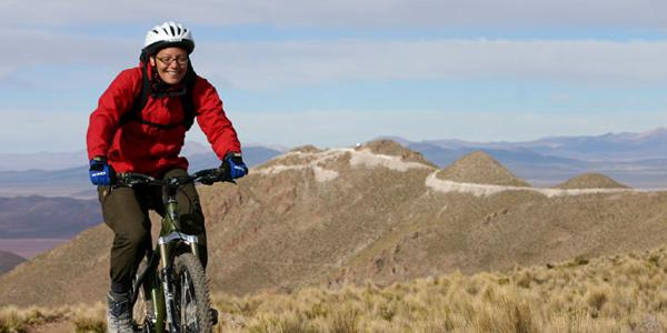 A biker rides through Peru