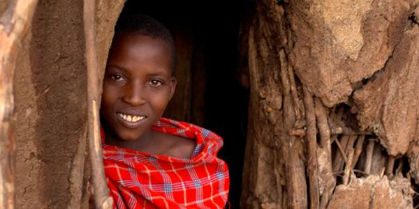 Smiling woman in doorway.