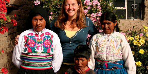 Smiling local Peruvian girls with traveller
