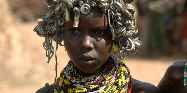 Ethiopian woman with metallic headwear.
