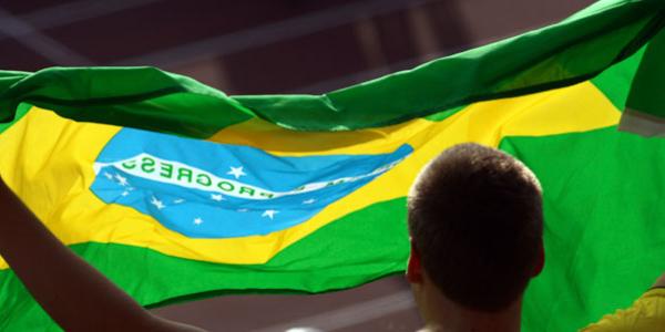 A fan showing his support for Brazil at a soccer game.