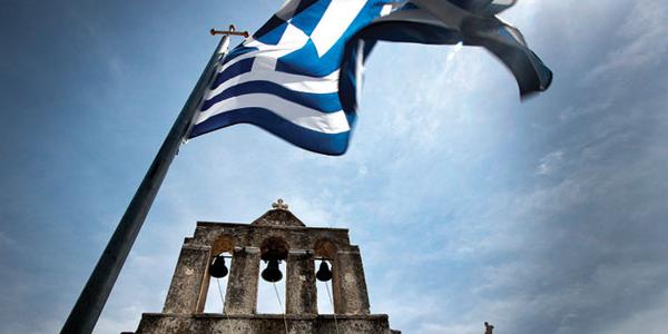The Greek flag waving in the wind.