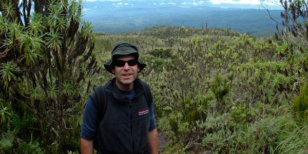 Man smiling along Mt. Kilimanjaro Machame trek