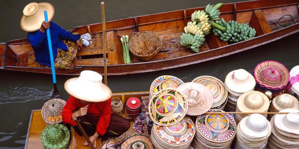 Locals river boating in Thailand