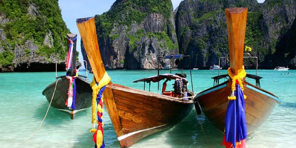 Boats in Thailand clear blue waters