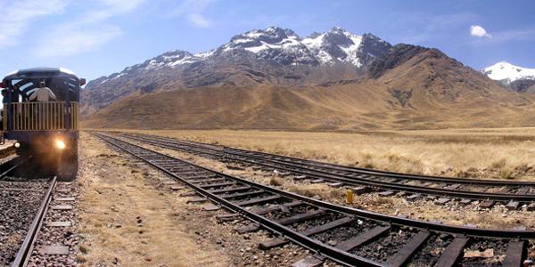Train tracks to Machu Picchu with mountain in distance 