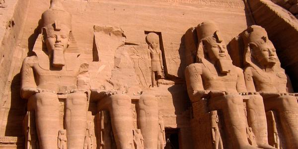 Huge seated statue guards outside the Abu Simbel temple in Egypt.