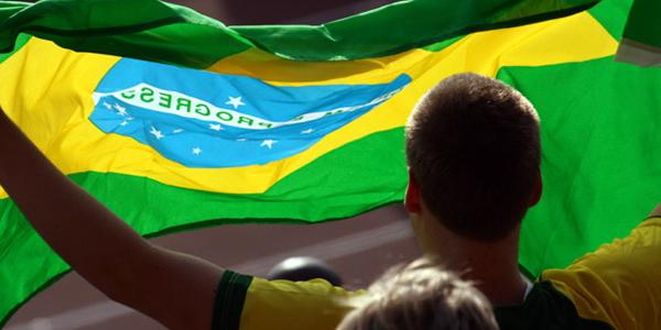 Man waving brazilian flag