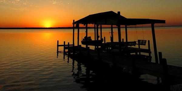 The sun sets over the Caribbean waters