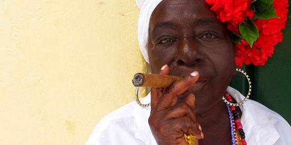 Smoking hand rolled cigars.