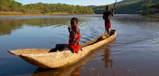 Children in a boat on the Okavanga river in Namibia.