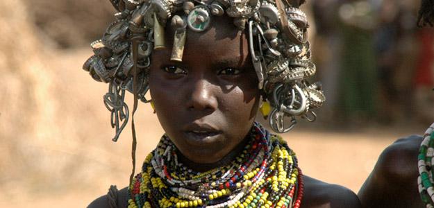 Ethiopian woman with metallic headwear.
