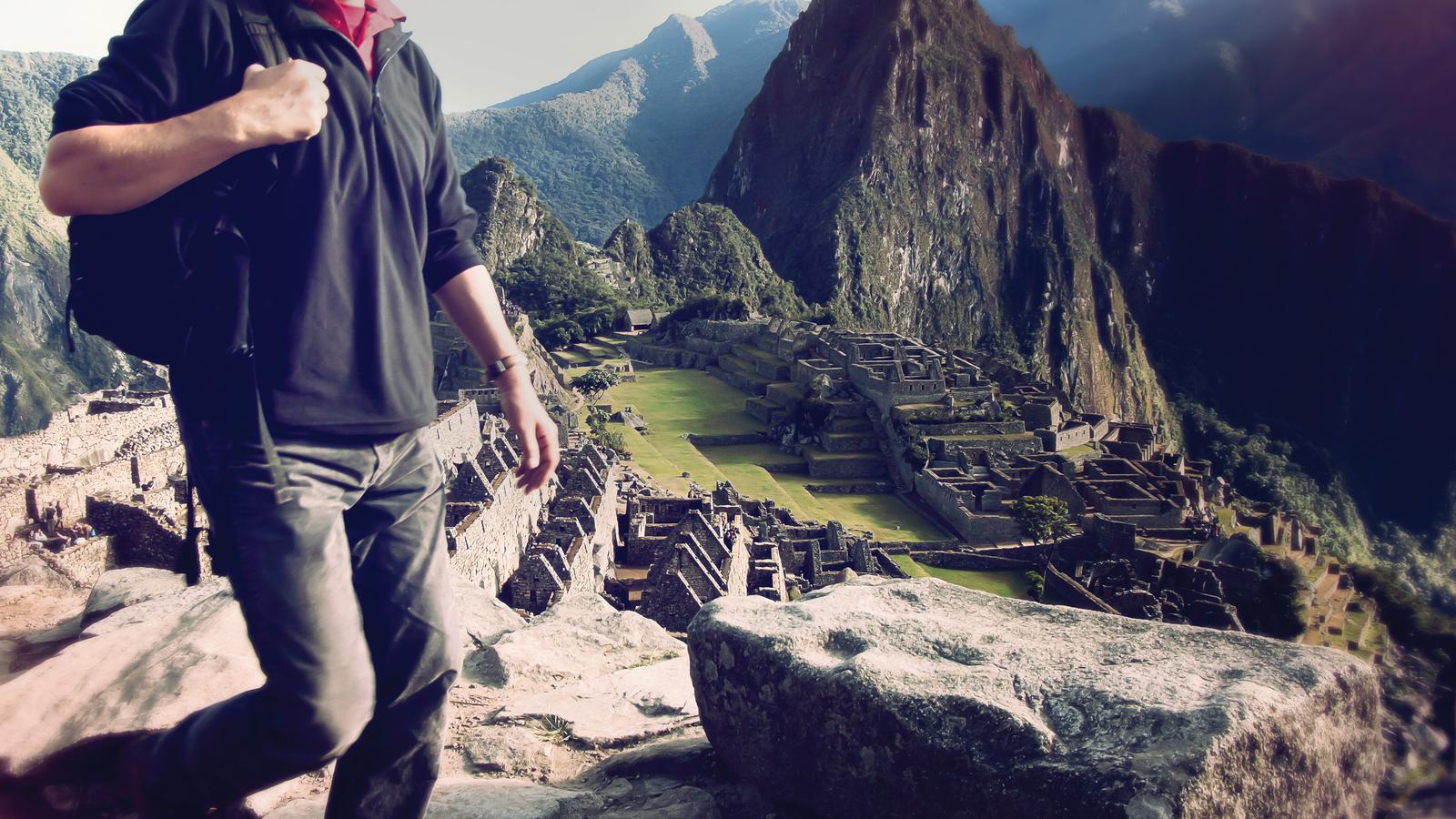 Traveller walking through Machu Picchu in Peru