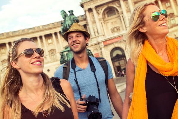 travellers wearing sunglasses, observing ancient buildings