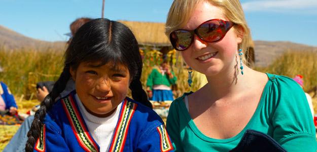 A traveller with a local Peruvian