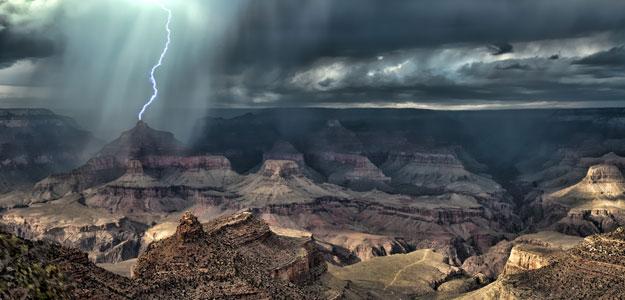 A bolt of lightening strikes in Monument Valley