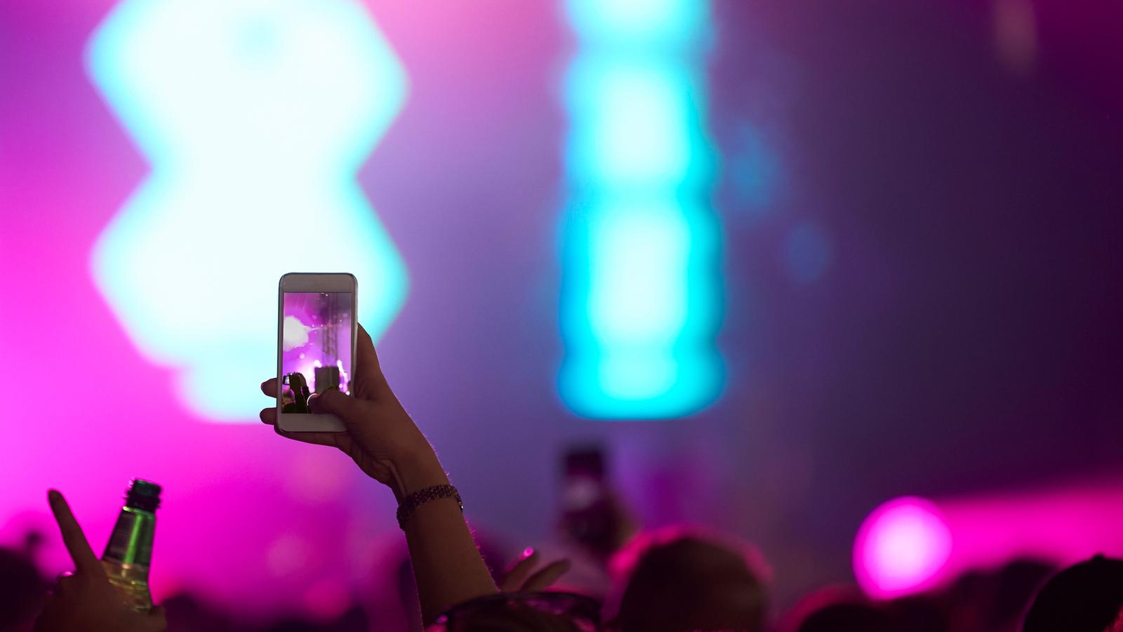 Concert goers shooting photo at Sziget Festival