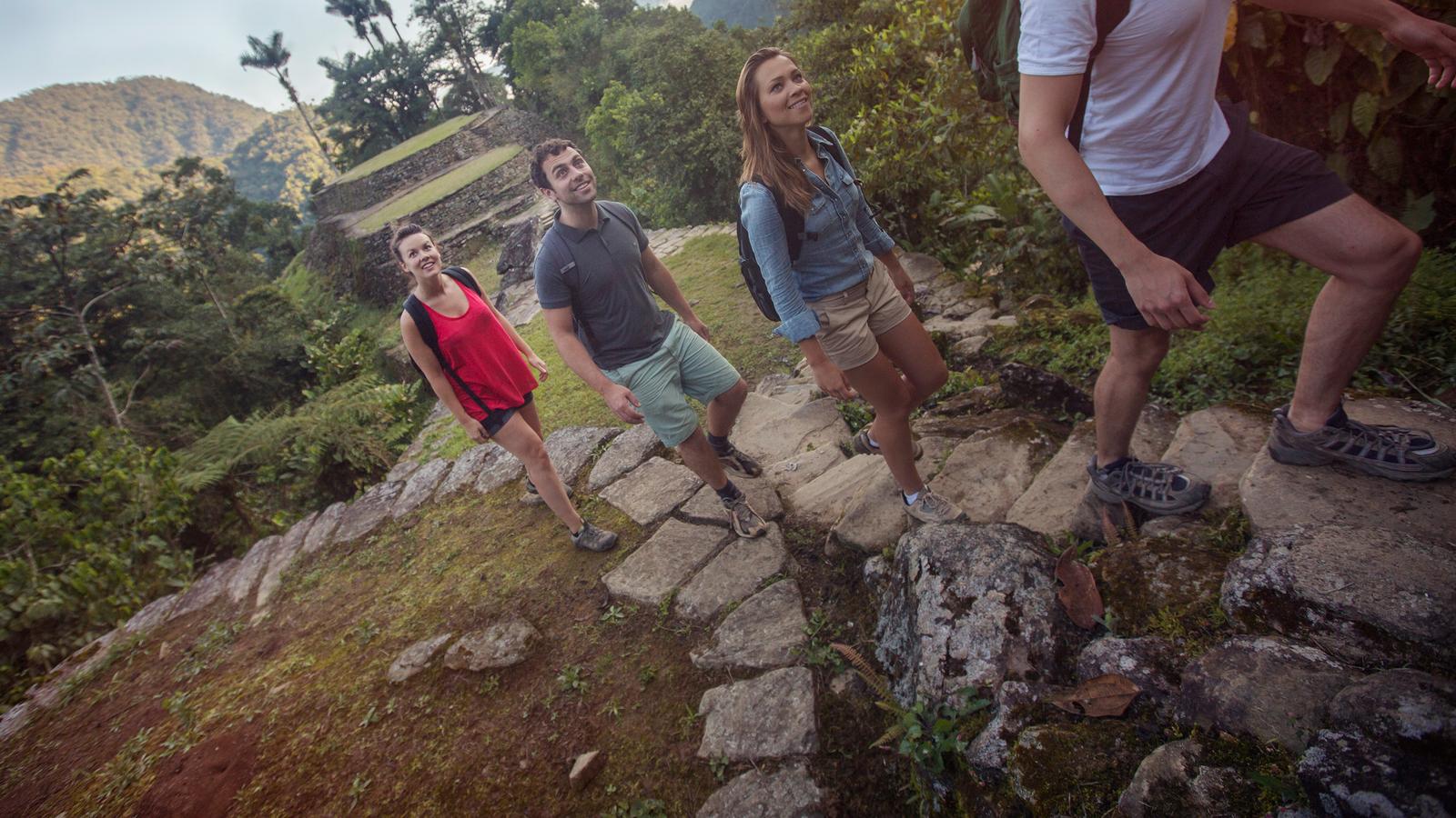 Travellers hiking up the mysterious and mesmerizing Lost City in Colombia