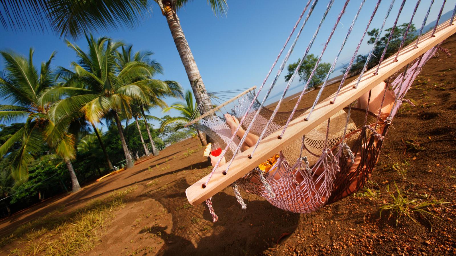 Female traveller chilling out on a hammock