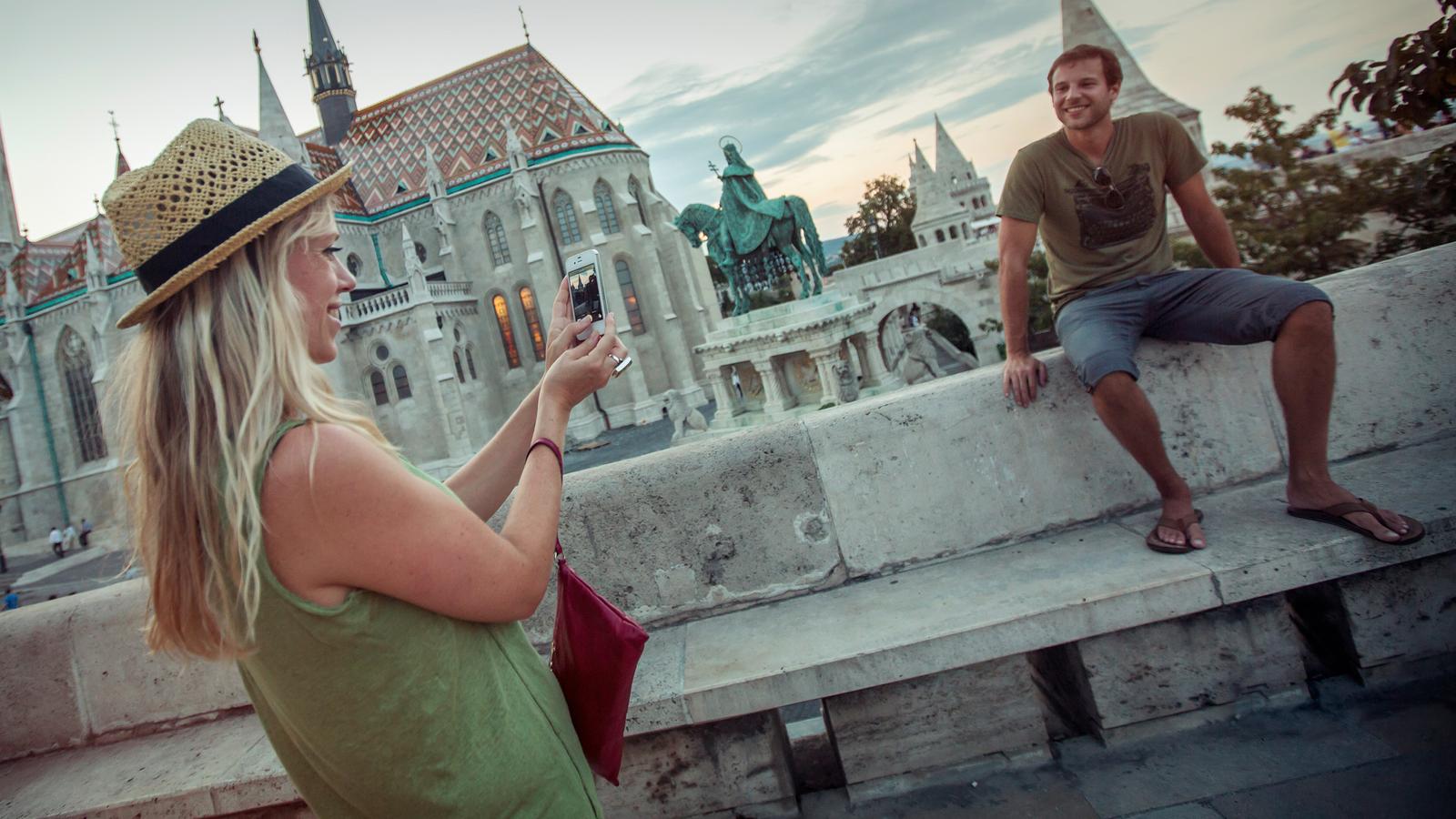 A couple taking photos in downtown Budapest, Hungary