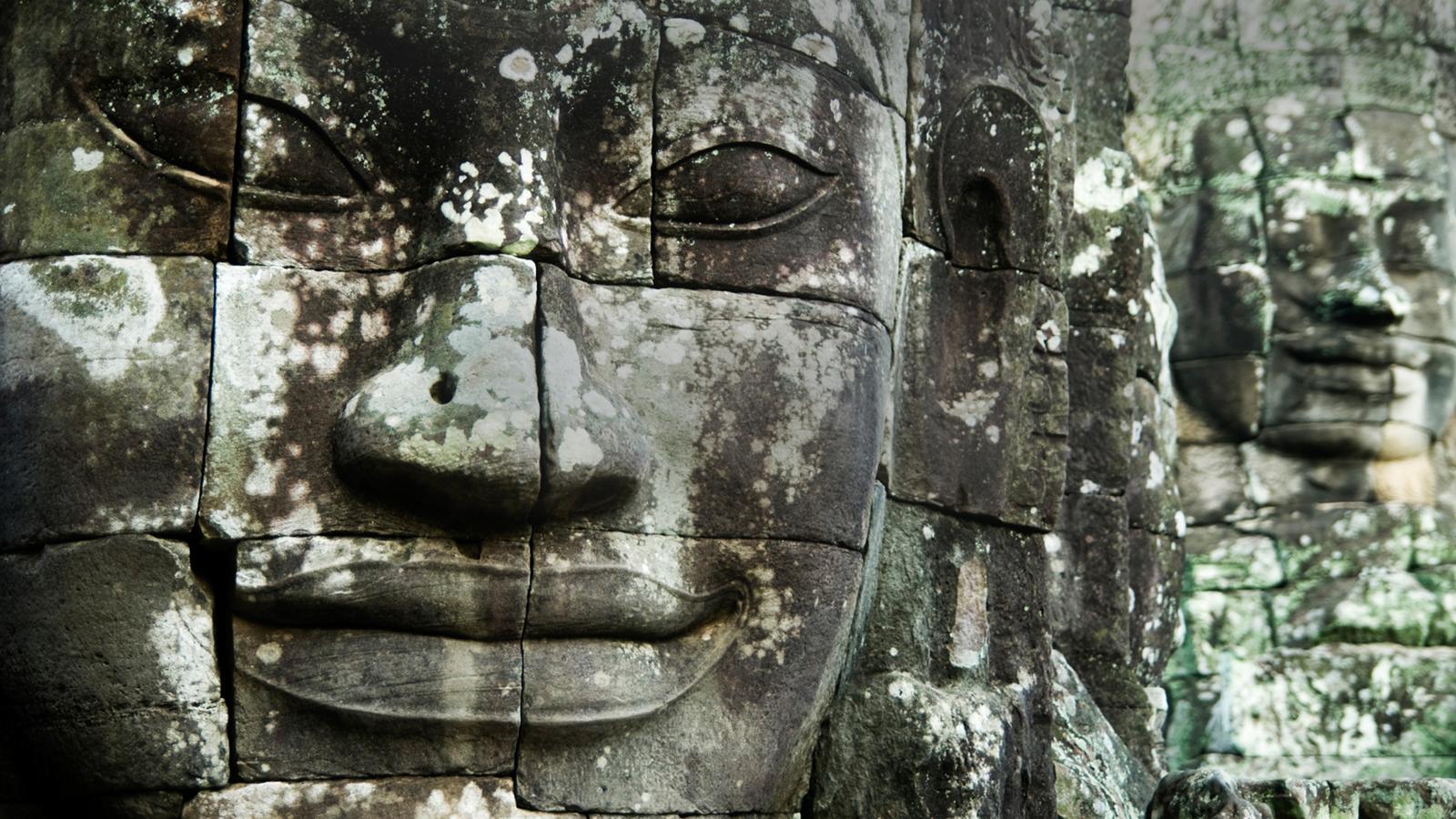 Close up of ancient faces on a temple