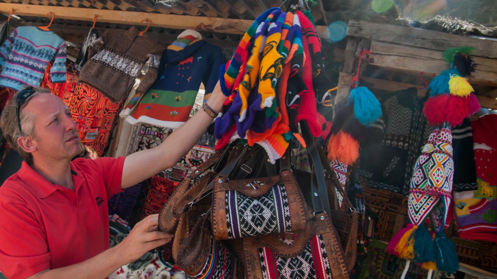 Traveller checking out the market at Machu Picchu