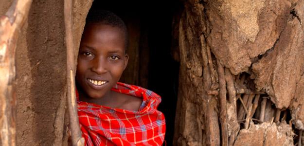 Smiling woman in a doorway.