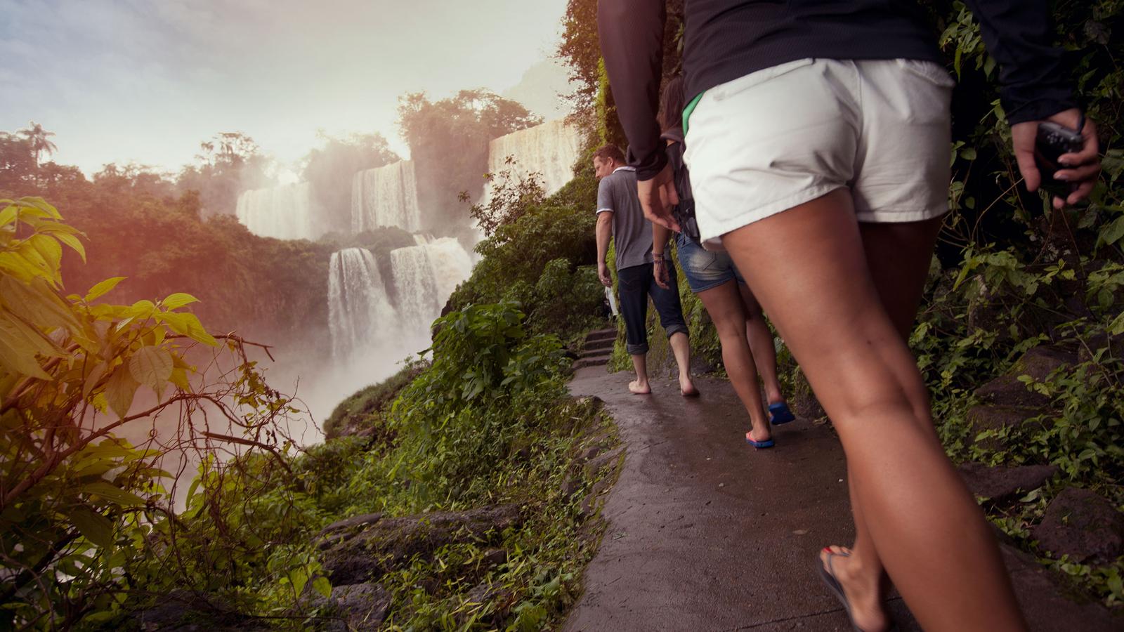 Travellers walking the stone path on the Brazil side of Iguassu Falls