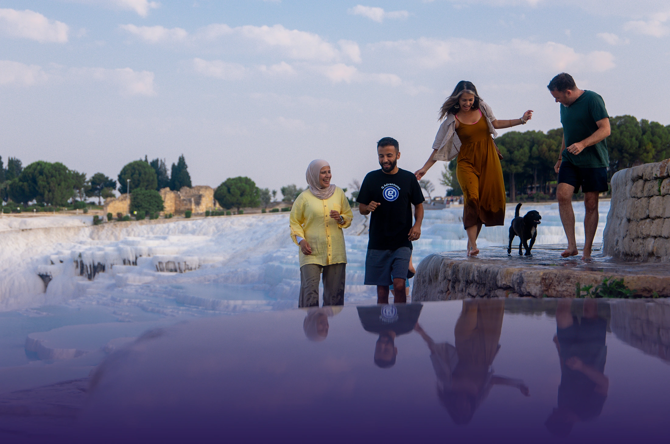 Travellers exploring the Pamukkale travertine terraces together