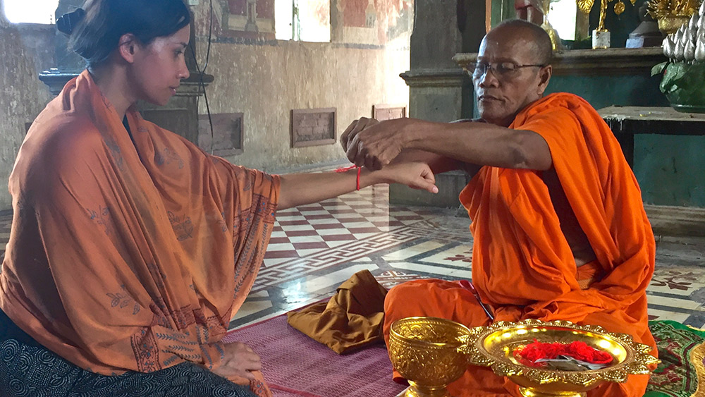 A Buddhist monk offers blessings at Wat Kampong Tralach Leu pagoda.