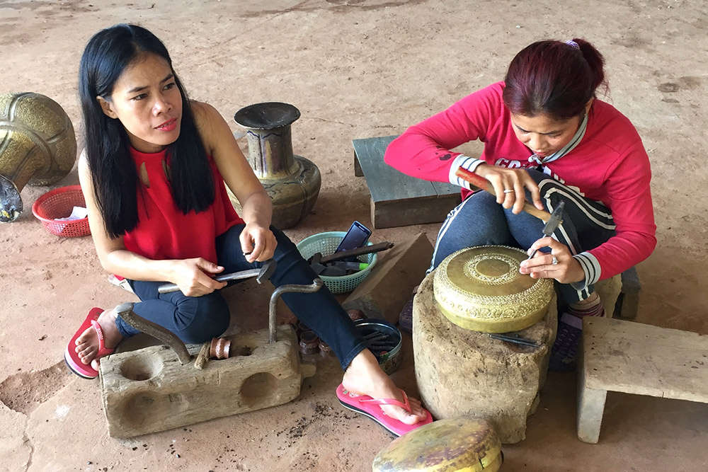 Local craftswomen at a copper factory in Koh Chen.