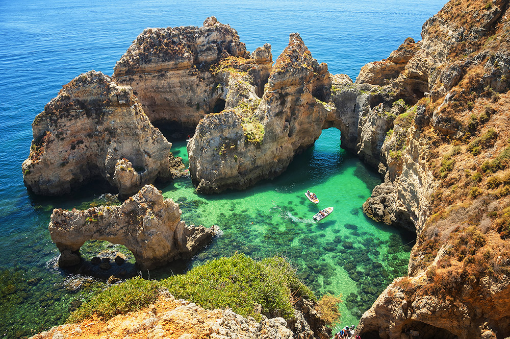 Natural arches and sandstone cliffs at Ponta da Piedade. Photo courtesy Madrugadaverde, Dreamstime.