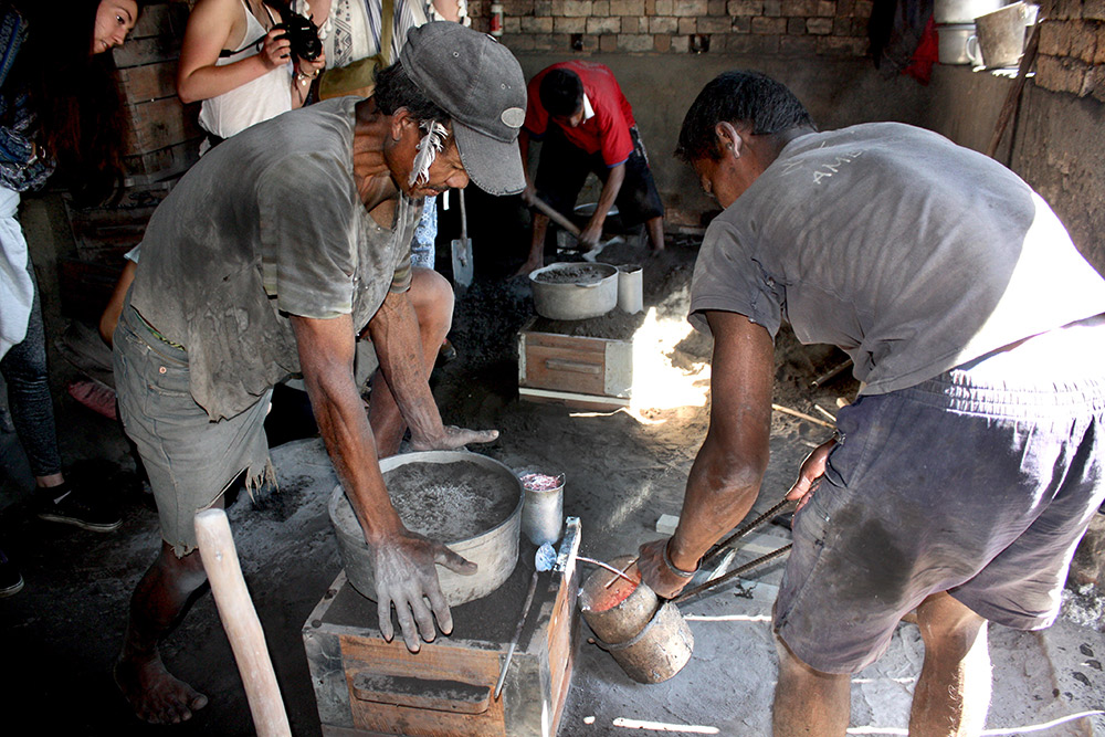 Here, workers melt down aluminum so it can be made into something new again.