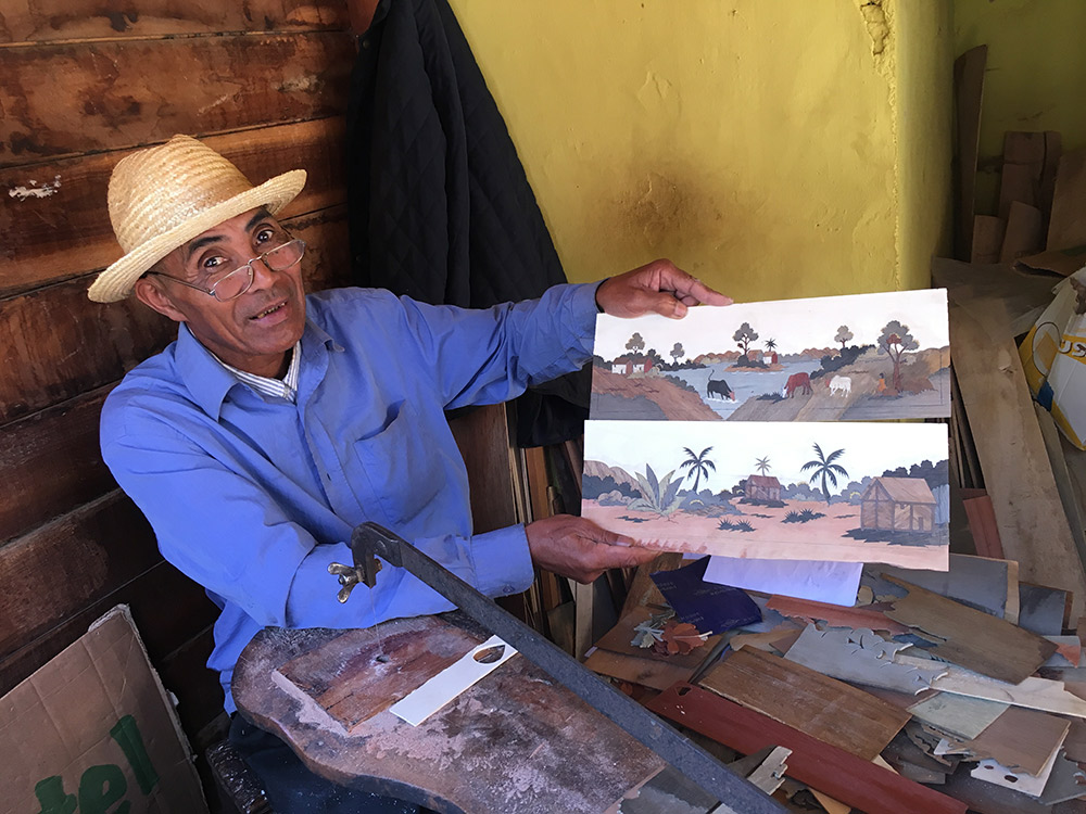 This artist creates his landscapes out of scrap lumber.