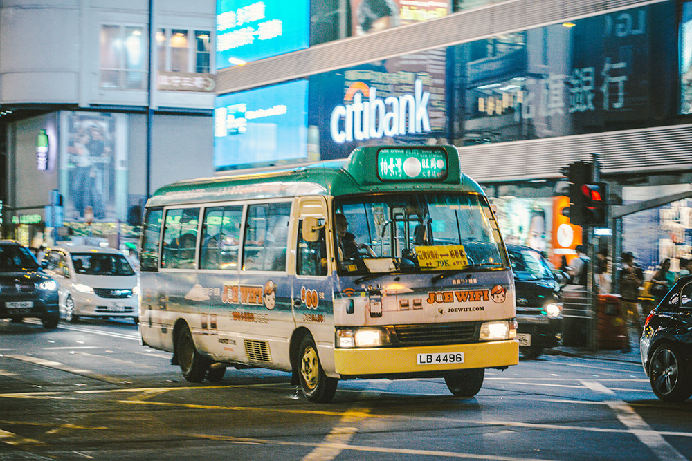 The green minibus operates like a regular bus, with a fixed route and fixed fares. Photo courtesy Hans J.