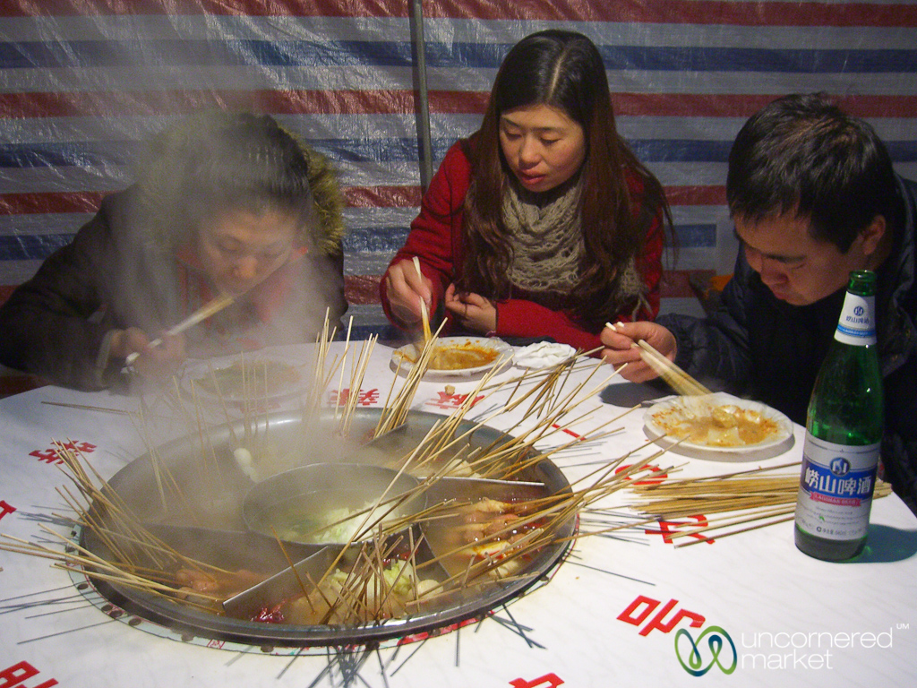 Street-side community hot pot in Qingdao, where everything cooks together.