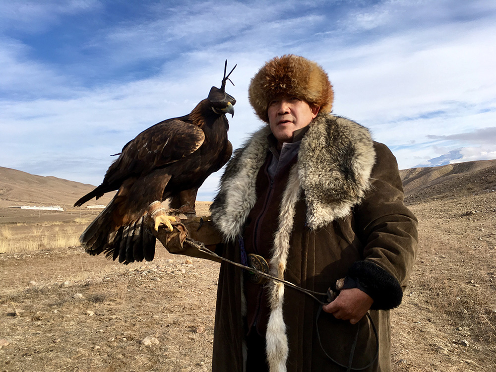 A golden eagle and his master up on the “jailoo,” or high pasture.