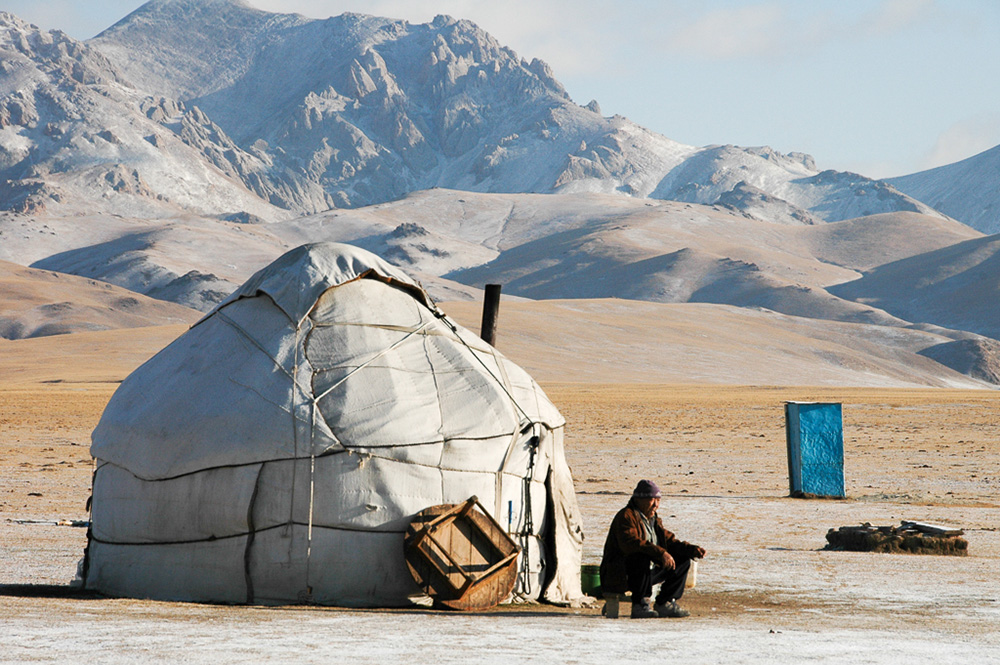 Morning tea outside the yurt at Song Kul Lake. With the first snowfall, the shepherds will soon pack up the yurts to go back to the village. 