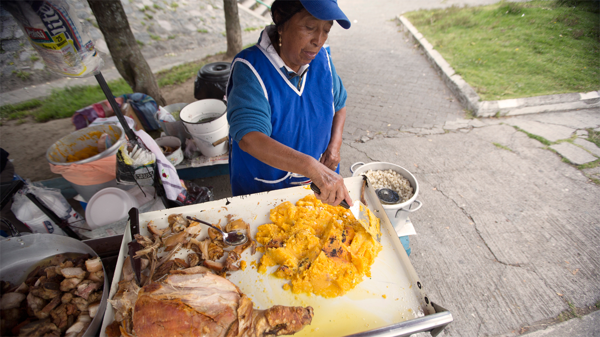 Quito street food vendor. Fewer travellers means fewer opportunities for people in local communities.