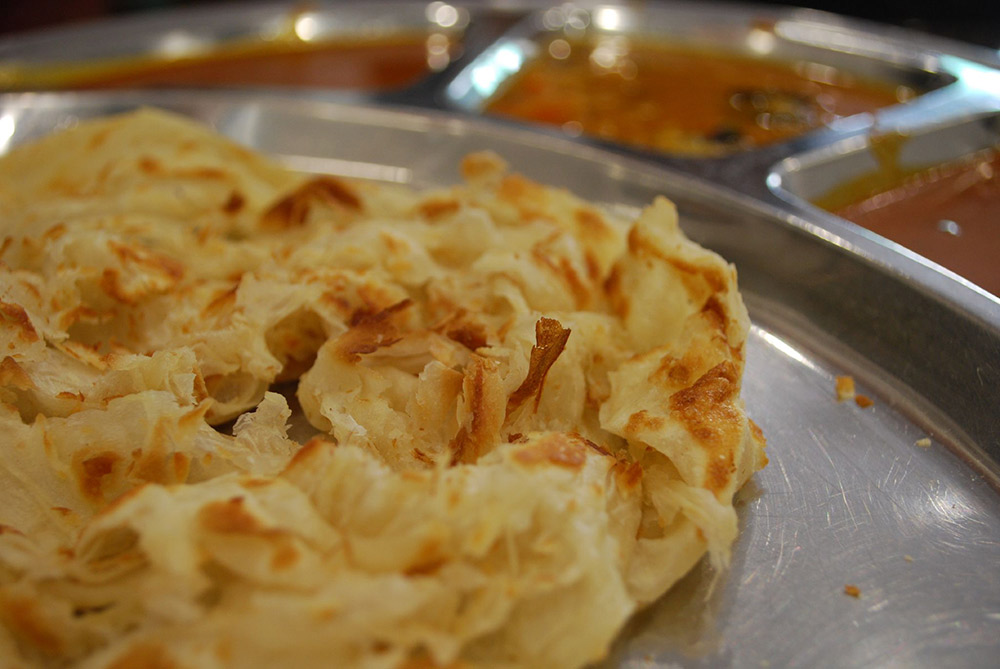 Try and watch the cook flipping the roti canai as its cooking for a real treat. Photo courtesy Alpha.