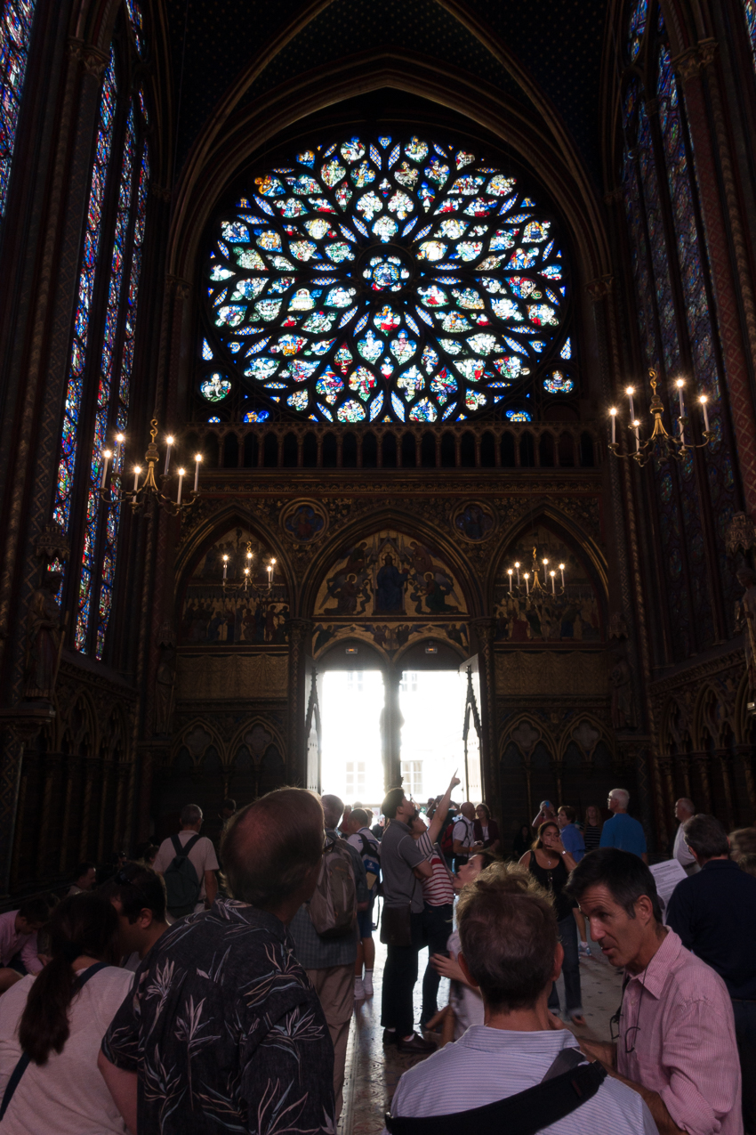 Include other elements in the frame to help show the size of the stained glass windows.