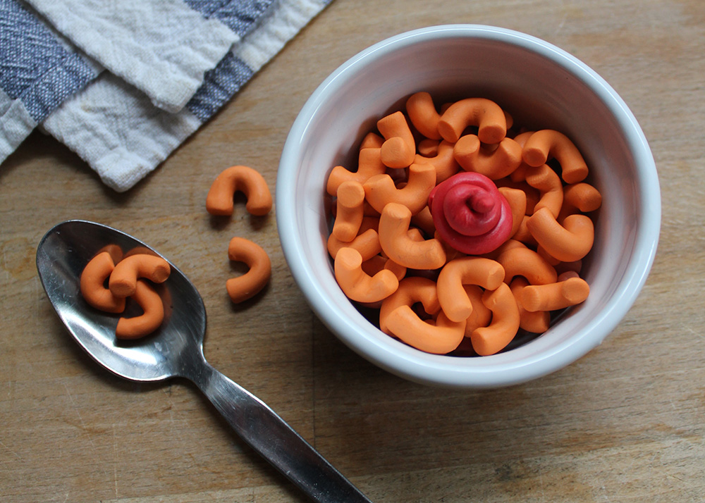 This tiny bowl of Kraft Dinner looks good enough to gobble up.