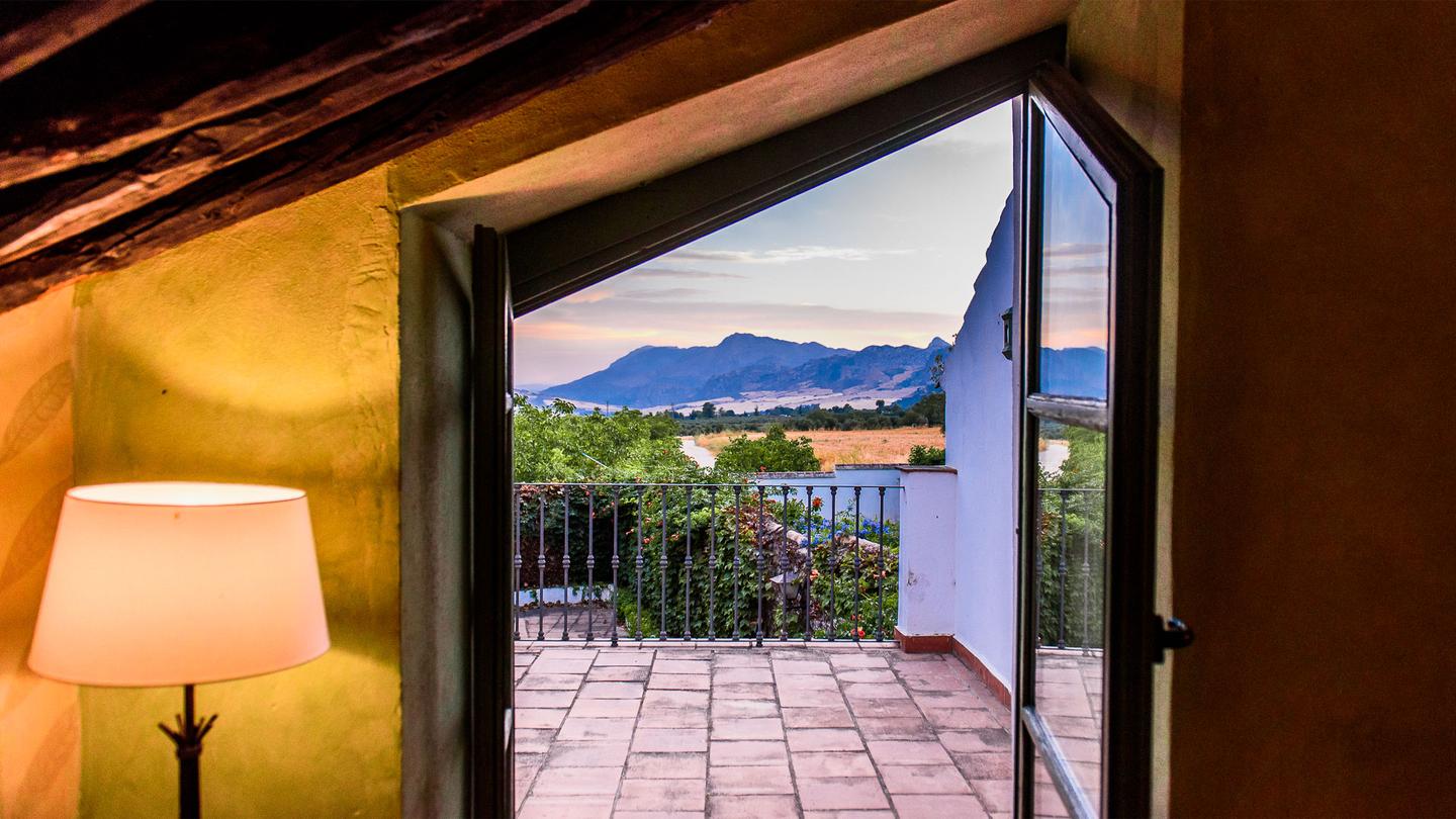 View of mountains from inside Hotel Molino del Arco