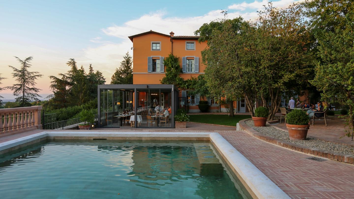 We can't think of anything better than a cold drink by the pool after walking the Tuscan hillside.